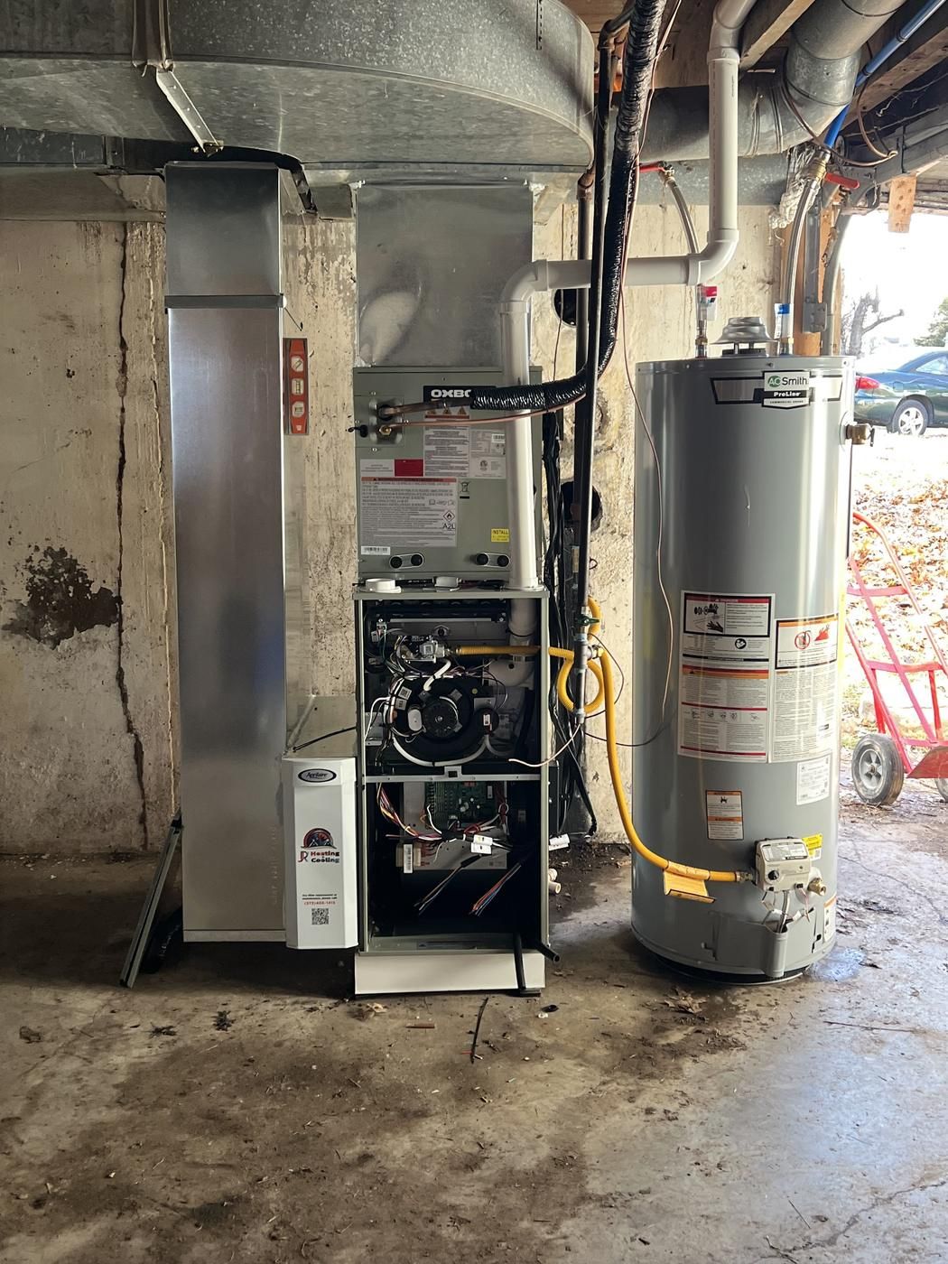Basement install: Oxbox furnace with an Aprilaire filter cabinet next to a water heater